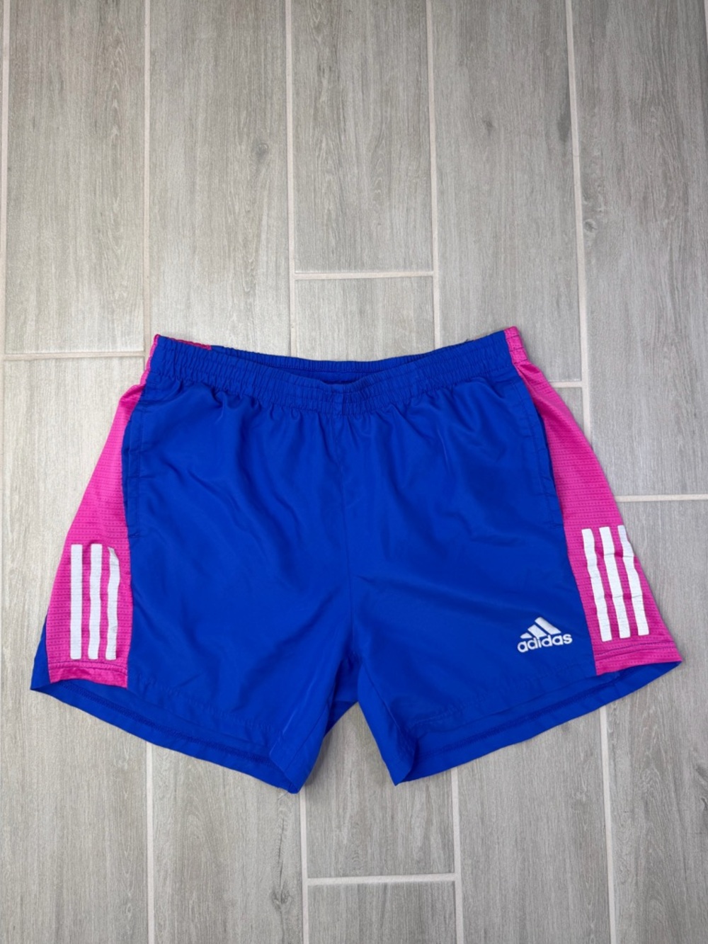adidas men’s Royal Blue Athletic Shorts with Pink Side Panels